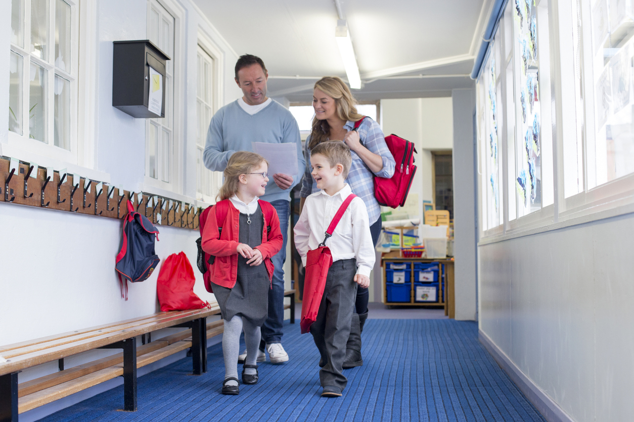 Parents walking kids from school